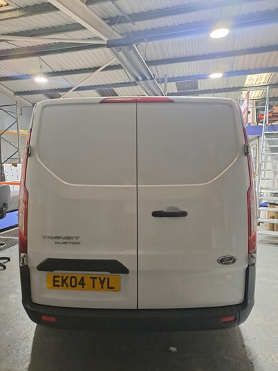 An image of the back of the white Ek Tiling van before vehicle graphics and wraps